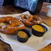 Pretzel Platter  · Two freshly baked pretzels served with IPA mustard, and warm queso.
