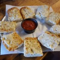 Cheesy Bread  · A full order of our delicious blend of cheeses, garlic, and oregano baked onto a French bagu...