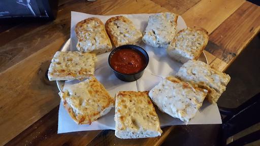 Cheesy Bread  · A full order of our delicious blend of cheeses, garlic, and oregano baked onto a French baguette. Served with our house-made marinara sauce.