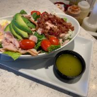 Cobb Salad  · Mix of romaine and spring lettuce, avocado, tomatoes, hard boiled egg, bacon bits, sliced tu...