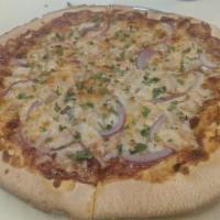 BBQ Chicken Pizza · Homemade beer BBQ sauce base, signature cheese blend, red onion, cilantro, and topped with c...