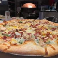 Chicken Bacon Ranch Pizza · A ranch base, spinach, bacon bits, chicken, signature cheese blend topped with a sprinkle of...