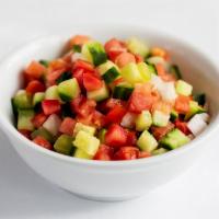 Salad Shirazi · Chopped cucumber, tomatoes, onions, lemon and olive.