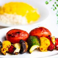 Veggie Kabob · Marinated mushrooms, tomatoes, green and red bell peppers, zucchini.