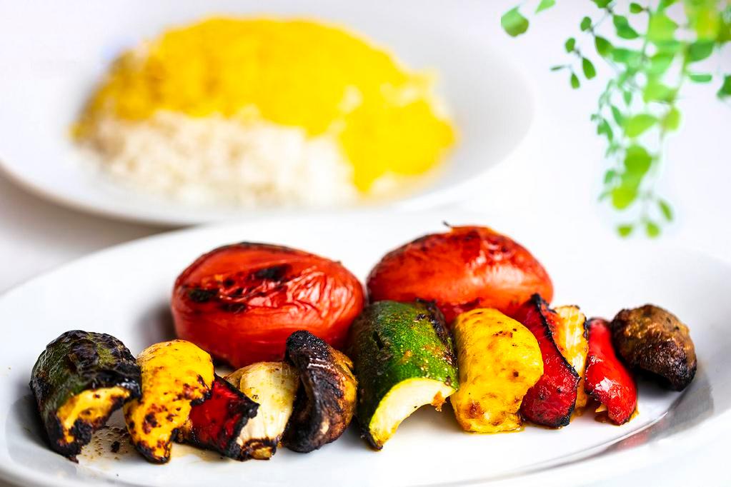 Veggie Kabob · Marinated mushrooms, tomatoes, green and red bell peppers, zucchini.
