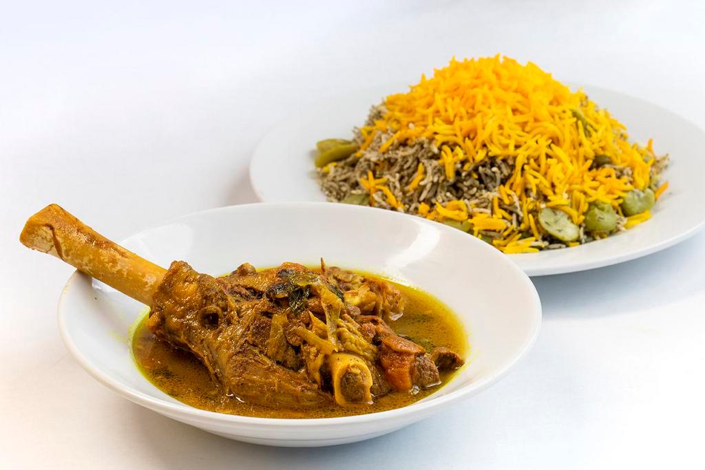 Lamb Shank  · Served with baghali polo. Slow cooked lamb shank with baghali polo (rice, dill and lima beans).