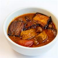 Khoresht Bademjoon · Chunk of Beef, Sautéed eggplant, cooked in tomato paste 