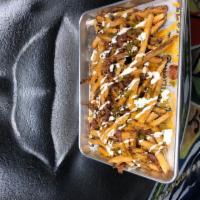 Loaded Cheese Fries · Whole lotta shredded cheddar, bacon, jalapenos & buttermilk ranch.
