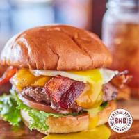 Brunch Burger · Applewood smoked bacon, cheddar cheese & homemade hash topped with fried egg.