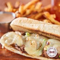 Philly Cheesesteak Sandwich · Steak or chicken, caramelized onions, mushroom, green peppers & provolone cheese.