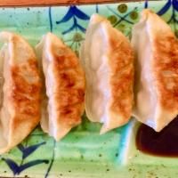 Gyoza · Pan-fried pork dumplings.
