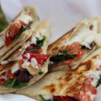 Mediterranean Quesadilla · Feta, spinach, sauteed onions, olives, roasted peppers, tomatoes and tzatziki sauce.