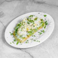 Esquite Toast · Avocado toast with Mexican street style corn, topped with queso Cotija & cilantro on sourdou...