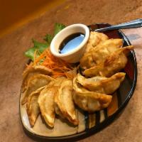 Potsticker · Deep fried mixed vegetables with pork stuffed in special wrapper served with chef's special ...