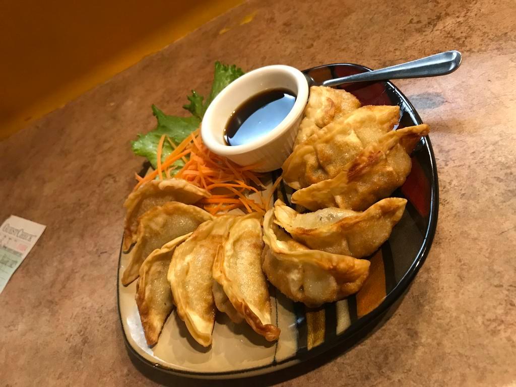 Potsticker · Deep fried mixed vegetables with pork stuffed in special wrapper served with chef's special sauce.
