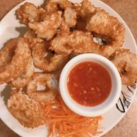 Calamari Rings · Deep fried calamari rings served with sweet chili sauce.
