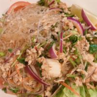 Yum Woon Sen Salad · Glass noodle, ground chicken, prawn, calamari, chili, red, green onion, cilantro, tomato and...