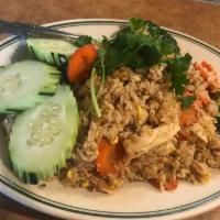 Fried Rice · Fried rice with eggs, tomato, onions, carrot, broccoli and cucumber topped with cilantro.