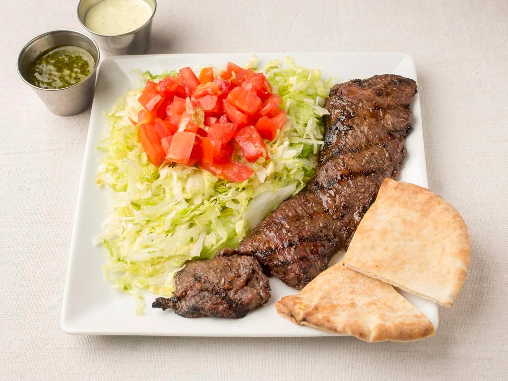 Churrasco Platter · Chopped specially marinated steak, lettuce, tomatoes and pita and your choice of sauce. No rice 