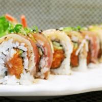 Hush Roll · Spicy tuna, shrimp, and albacore on top with ponzu sauce. Spicy.