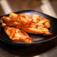 Kid's Grilled Chicken Strips · 4 strips of our grilled chicken breast with a choice of dipping sauce.