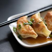 Potstickers · Pork, ginger, garlic, and local cabbage potickers steamed and seared to order. Served with d...