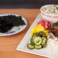 Pickle Plate · Assorted seasonal pickle plate with ginger-green onion rice and Korean seaweed. Vegan. Glute...