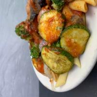 Penne Primavera · Broccoli, zucchini, onions and broccoli in marinara sauce. Served with homemade bread glazed...