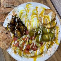 Sabich Platter · Hummus plate with 2 sliced hard-boiled eggs, fried eggplant, Israeli pickles, tahini and amb...