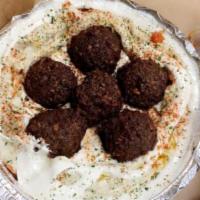 Falafel Platter · Hummus plate with 4 falafel balls, tahini and Israeli spices. Served with homemade mini garl...