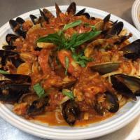 Seafood Fra Diablo · Shrimp, clams, and mussels in a spicy marinara sauce served with linguine.