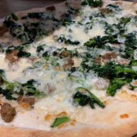 Broccoli Rabe and Sausage Pizza  · Spread on a white crust with no sauce.