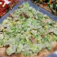 Grilled Chicken Caesar Pizza  · Diced grilled chicken over classic Caesar salad cold.