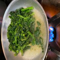 Sauteed Broccoli Rabe · With garlic and olive oil.