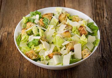 Caesar Salad · Crisp romaine lettuce hearts, toasted garlic croutons and shaved Asiago cheese.