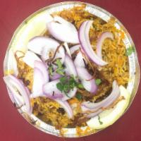 Chicken Biryani · Aromatic basmati rice with saffron, nuts and raisin.