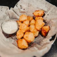 Clockshadow Cheese Curds · Battered and fried. Served with ranch dipping sauce