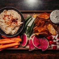 Hummus Duo · House made classic and chipotle hummus, pickled veggies, seasonal veggie medley, and toasted...