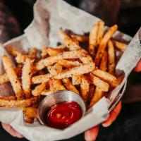 Truffle Fries · Dusted with parmesan & herb, truffle oil, and served with garlic aioli