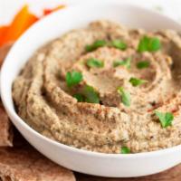 Baba Ghanoush · Eggplant, tahini, olive oil and traditional spices served with tandoor bread