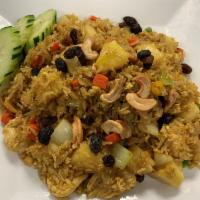 Pineapple Fried Rice · Jasmine rice, egg, onion, mixed vegetable, cashew nut, raisin and pineapple.