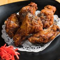 Yama Wings · 5 pieces. Marinated fried chicken wings with soy and topped with sesame pepper.