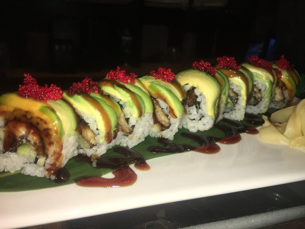 Dragon Roll · Eel roll wrapped with avocado and tobiko.