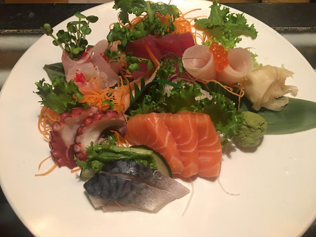 Sashimi Deluxe · 3 bigeye tuna, 3 white fish, 3 salmon, 3 mackerel and 2 yellowtail sashimi and 2 octopus sashimi and 1 shrimp sashimi. Served with sushi rice.