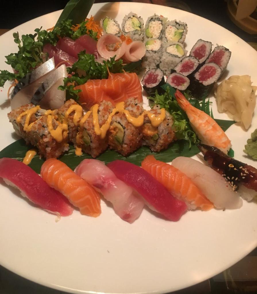 Sushi and Sashimi for 2 · 12 sashimi, 8 sushi, tuna roll, California roll and Manhattan signature roll.