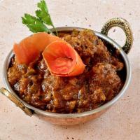 Lamb Bhuna · Tender cubes of lamb cooked with onions, bell-peppers and aromatic spices.