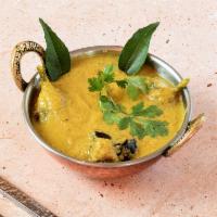 Baghare Baingan · Baby eggplant simmered with roasted spices in coconut and peanut sauce.