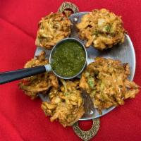 Vegetable Pakora · Onion, spinach, cabbage, cooked with himalayan spices and herbs. Served with mint chutney. V...