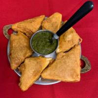 Paneer pakora · Homemade cheese deep in chickpea flour batter and deep fried. Serve with mint chutney.