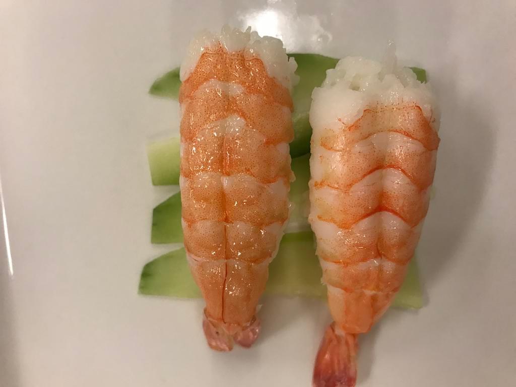 Ebi Nigiri · 2 pieces of cooked shrimp.